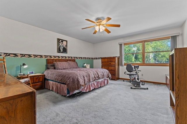 bedroom with ceiling fan and carpet floors