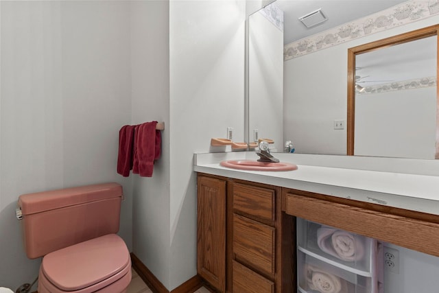 bathroom with vanity and toilet