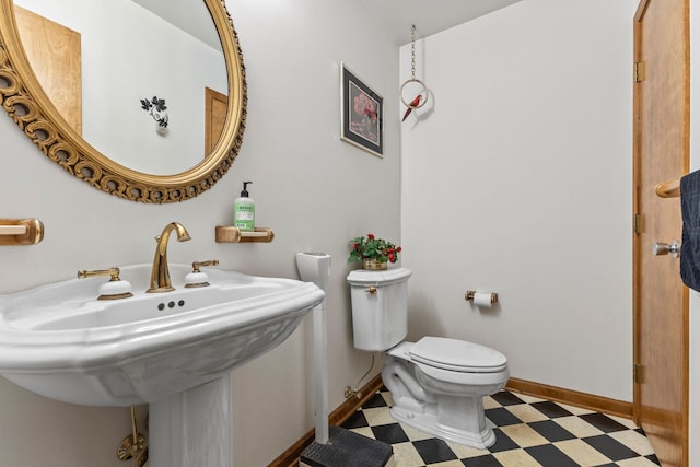 bathroom with sink and toilet