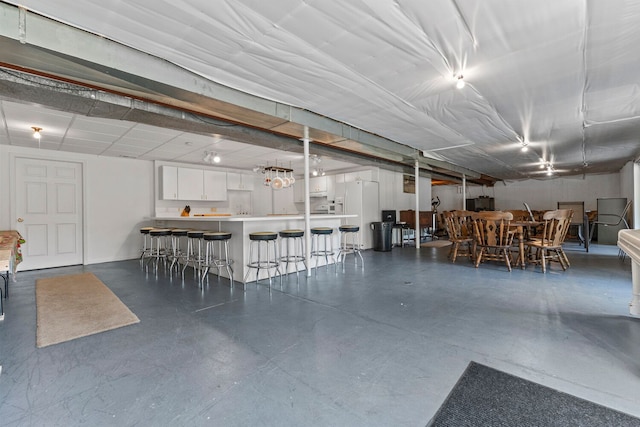 interior space featuring white fridge with ice dispenser