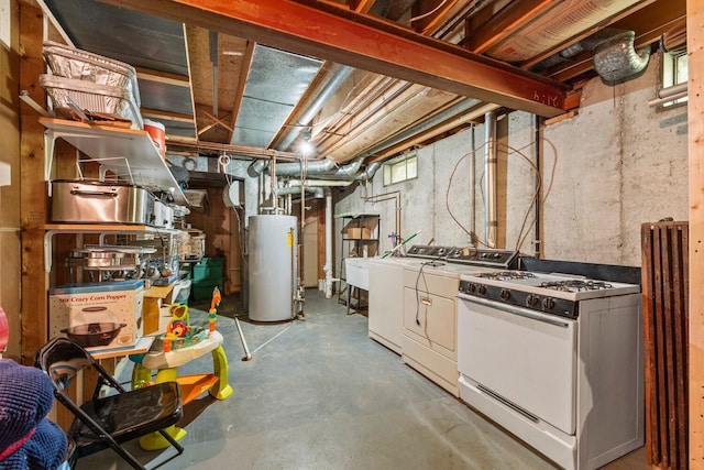 basement featuring washer and dryer and gas water heater