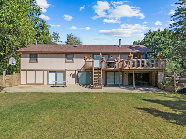 back of house featuring a patio area, a yard, and a wooden deck