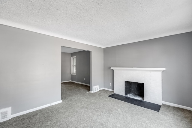 unfurnished living room with carpet, a fireplace, and a textured ceiling