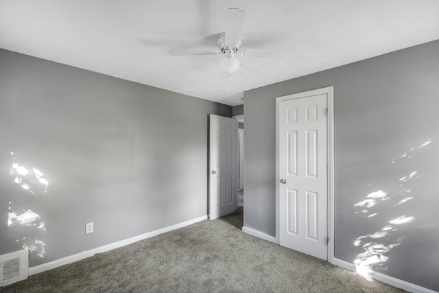 unfurnished bedroom with carpet flooring and ceiling fan