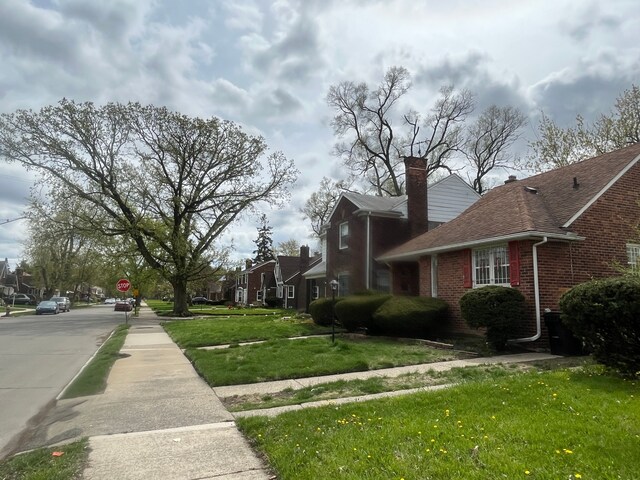 view of property exterior featuring a lawn