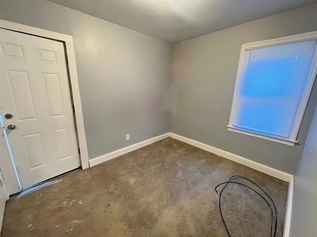 empty room with baseboards