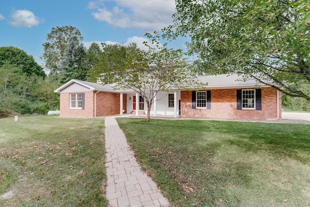 ranch-style house with a porch and a front lawn