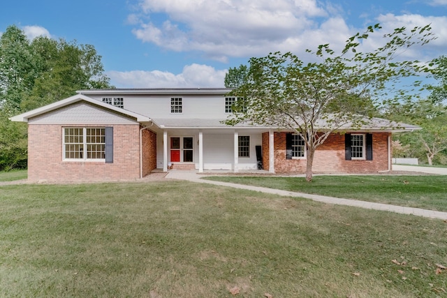 view of property featuring a front lawn