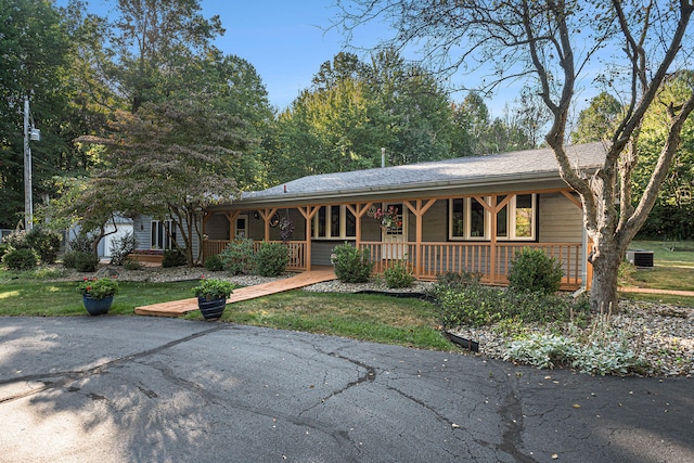 ranch-style home featuring cooling unit