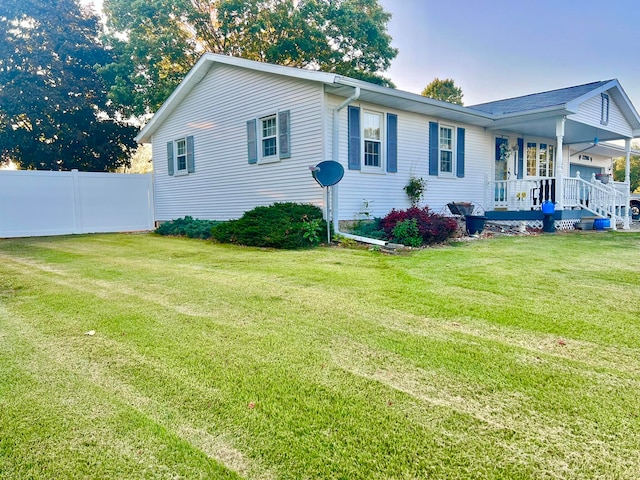 exterior space with a front lawn and a porch