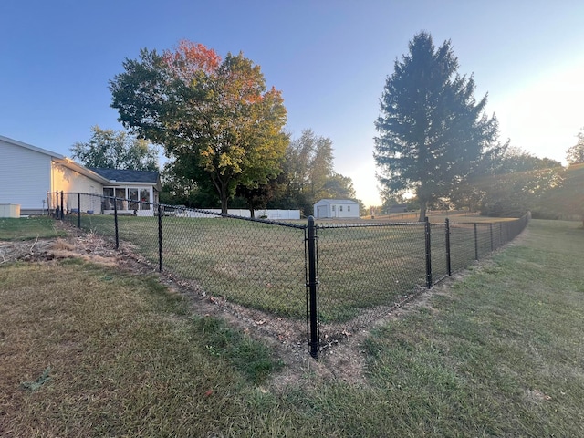 view of yard featuring a rural view and a storage shed