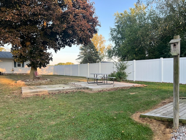 yard at dusk with a patio