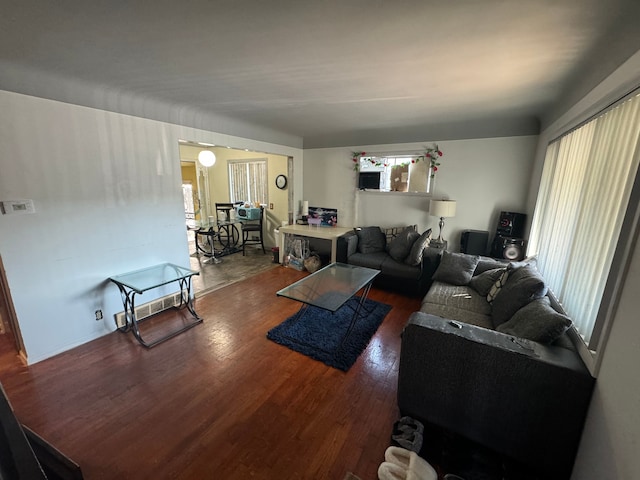 living room with dark wood-type flooring