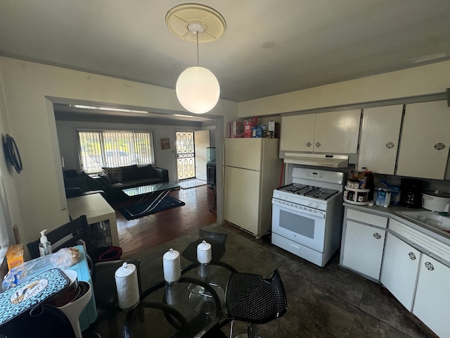 kitchen with sink, dark hardwood / wood-style floors, decorative light fixtures, white appliances, and white cabinets