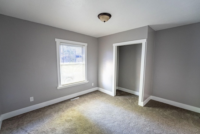 unfurnished bedroom featuring carpet floors