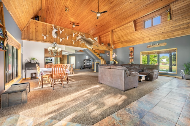 living room with ceiling fan with notable chandelier, carpet floors, high vaulted ceiling, and wooden ceiling