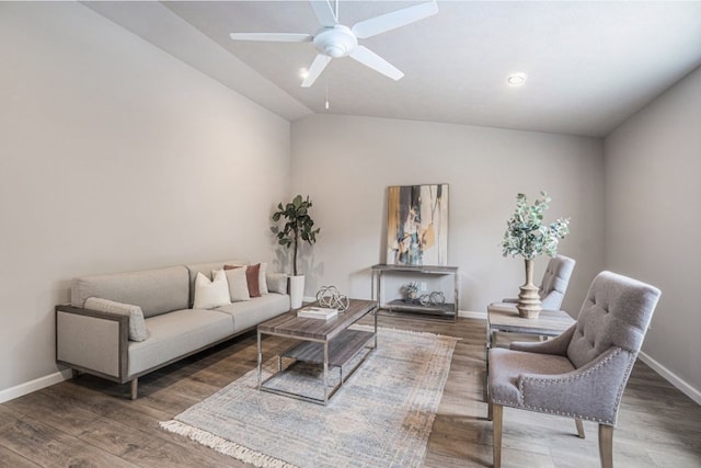 living room with dark hardwood / wood-style floors, vaulted ceiling, and ceiling fan