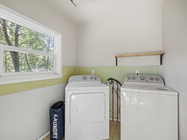 washroom featuring washing machine and dryer