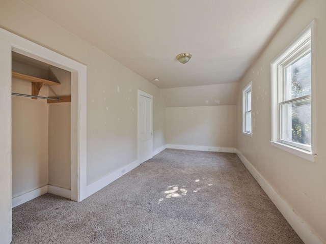 unfurnished bedroom with a closet and carpet floors