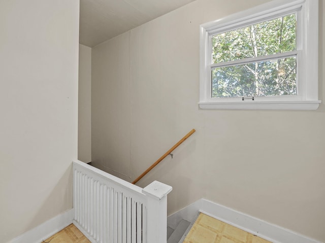 stairway featuring radiator