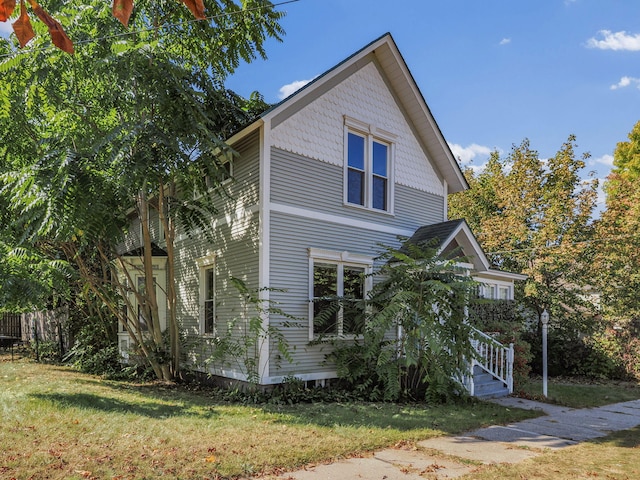 view of home's exterior featuring a lawn