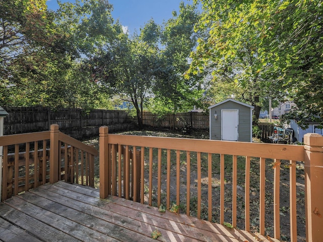 wooden terrace with a storage shed