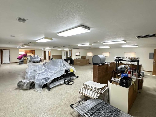 miscellaneous room featuring a textured ceiling