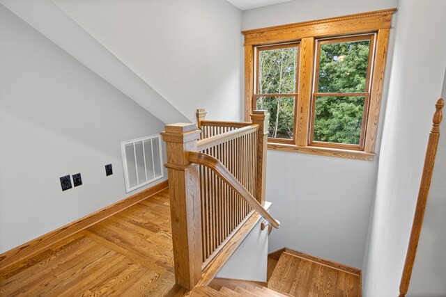 5721 Broomhead Rd, Williamsburg, MI 49690 - stairway with baseboards and wood finished floors
