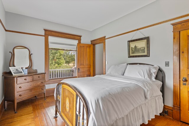 5721 Broomhead Rd, Williamsburg, MI 49690 - bedroom featuring light wood finished floors and baseboards