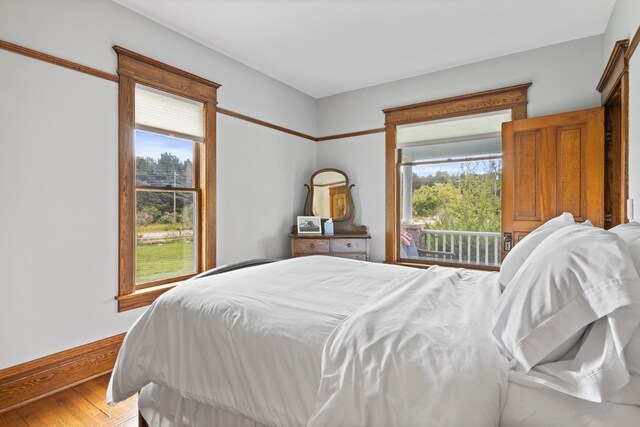 5721 Broomhead Rd, Williamsburg, MI 49690 - bedroom with light wood-type flooring and baseboards