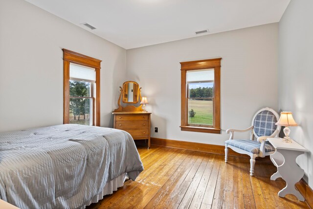 5721 Broomhead Rd, Williamsburg, MI 49690 - bedroom featuring wood-type flooring and baseboards
