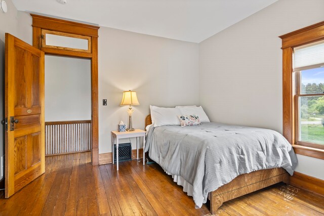 5721 Broomhead Rd, Williamsburg, MI 49690 - bedroom with hardwood / wood-style floors and baseboards