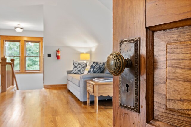 5721 Broomhead Rd, Williamsburg, MI 49690 - living area with wood finished floors and baseboards