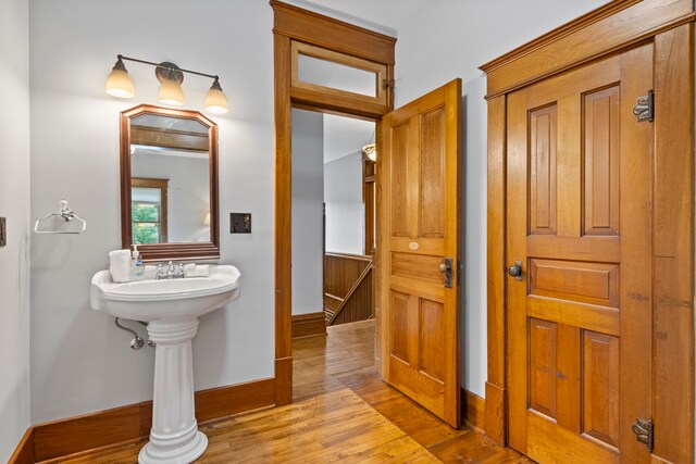 5721 Broomhead Rd, Williamsburg, MI 49690 - bathroom with hardwood / wood-style flooring and baseboards