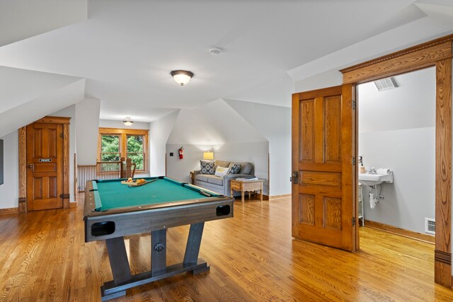 5721 Broomhead Rd, Williamsburg, MI 49690 - playroom featuring wood finished floors, billiards, and baseboards