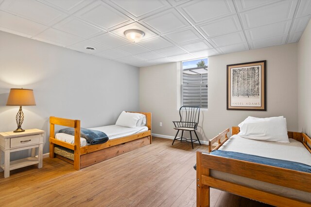 5721 Broomhead Rd, Williamsburg, MI 49690 - bedroom with baseboards and light wood finished floors