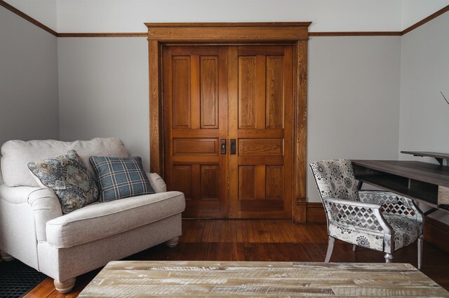5721 Broomhead Rd, Williamsburg, MI 49690 - living area featuring wood-type flooring and ornamental molding