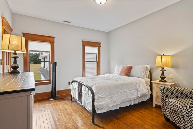 5721 Broomhead Rd, Williamsburg, MI 49690 - bedroom featuring hardwood / wood-style flooring and baseboards