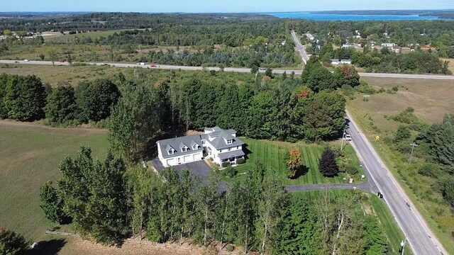 5721 Broomhead Rd, Williamsburg, MI 49690 - aerial view of property's location with a forest