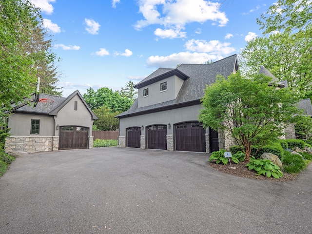 view of side of home with a garage