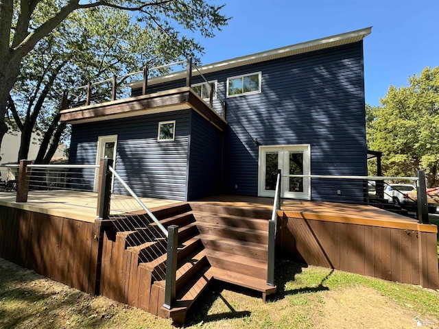 back of property with french doors and a deck