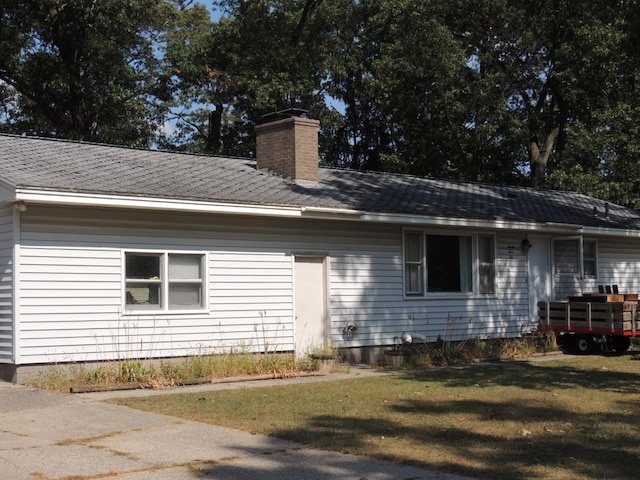 view of home's exterior with a yard