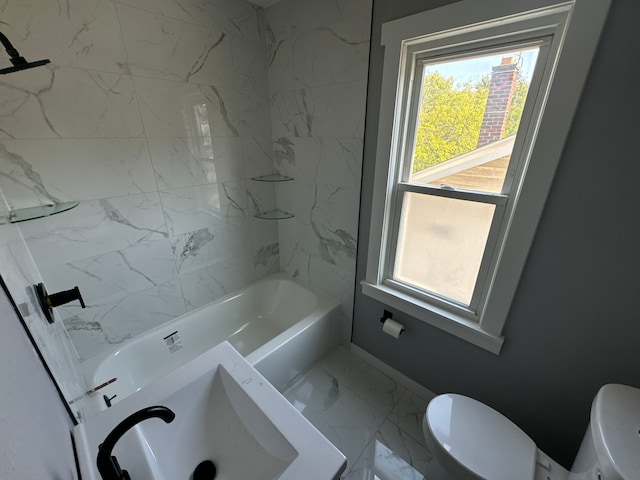 bathroom featuring toilet and tiled shower / bath