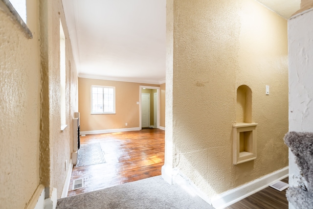 16184 Manor St, Detroit, MI 48221 - hallway featuring crown molding, a textured wall, wood finished floors, and baseboards