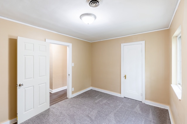 16184 Manor St, Detroit, MI 48221 - unfurnished bedroom featuring crown molding, carpet flooring, and baseboards