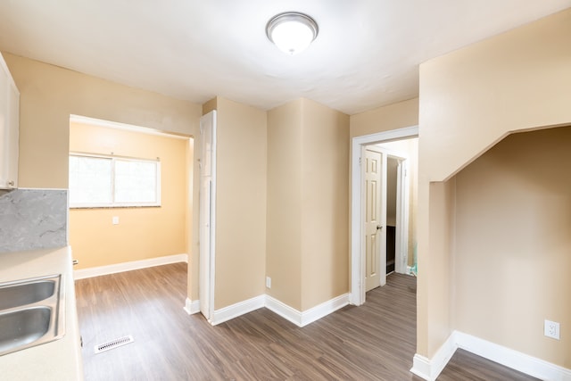 16184 Manor St, Detroit, MI 48221 - interior space featuring dark wood-type flooring, a sink, and baseboards