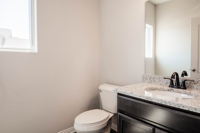 53207 Woodland Mdws, Chesterfield, MI 48047 - bathroom with a wealth of natural light, baseboards, vanity, and toilet