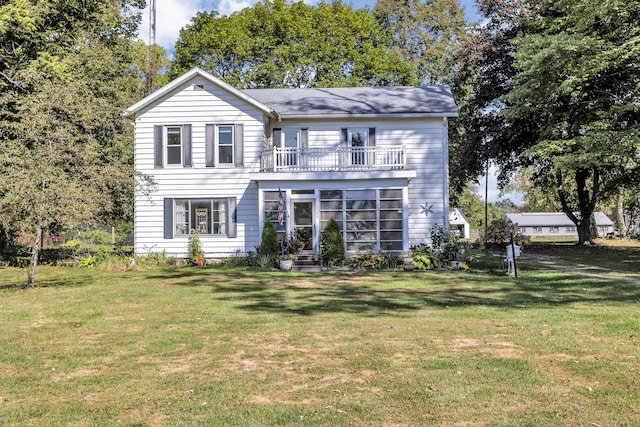 10526 Spring Arbor Rd, Spring Arbor, MI 49283 - traditional-style house featuring a balcony and a front yard