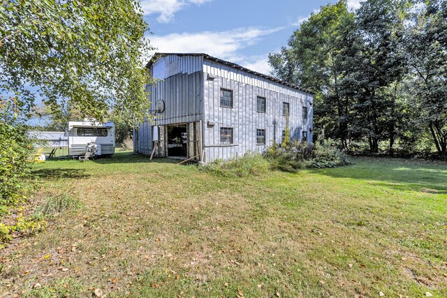 10526 Spring Arbor Rd, Spring Arbor, MI 49283 - view of property exterior featuring a yard, an outdoor structure, and board and batten siding