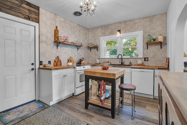10526 Spring Arbor Rd, Spring Arbor, MI 49283 - kitchen with wood counters, white appliances, open shelves, a sink, and white cabinets